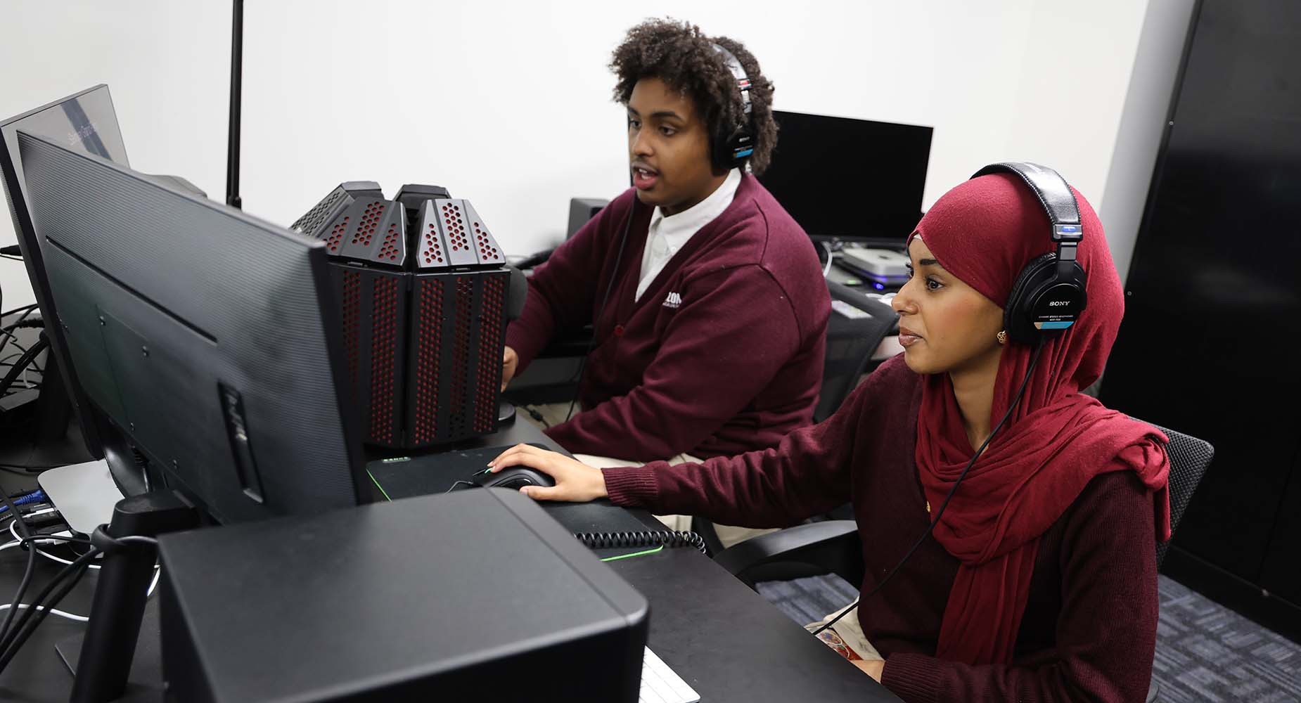 Teacher helping student