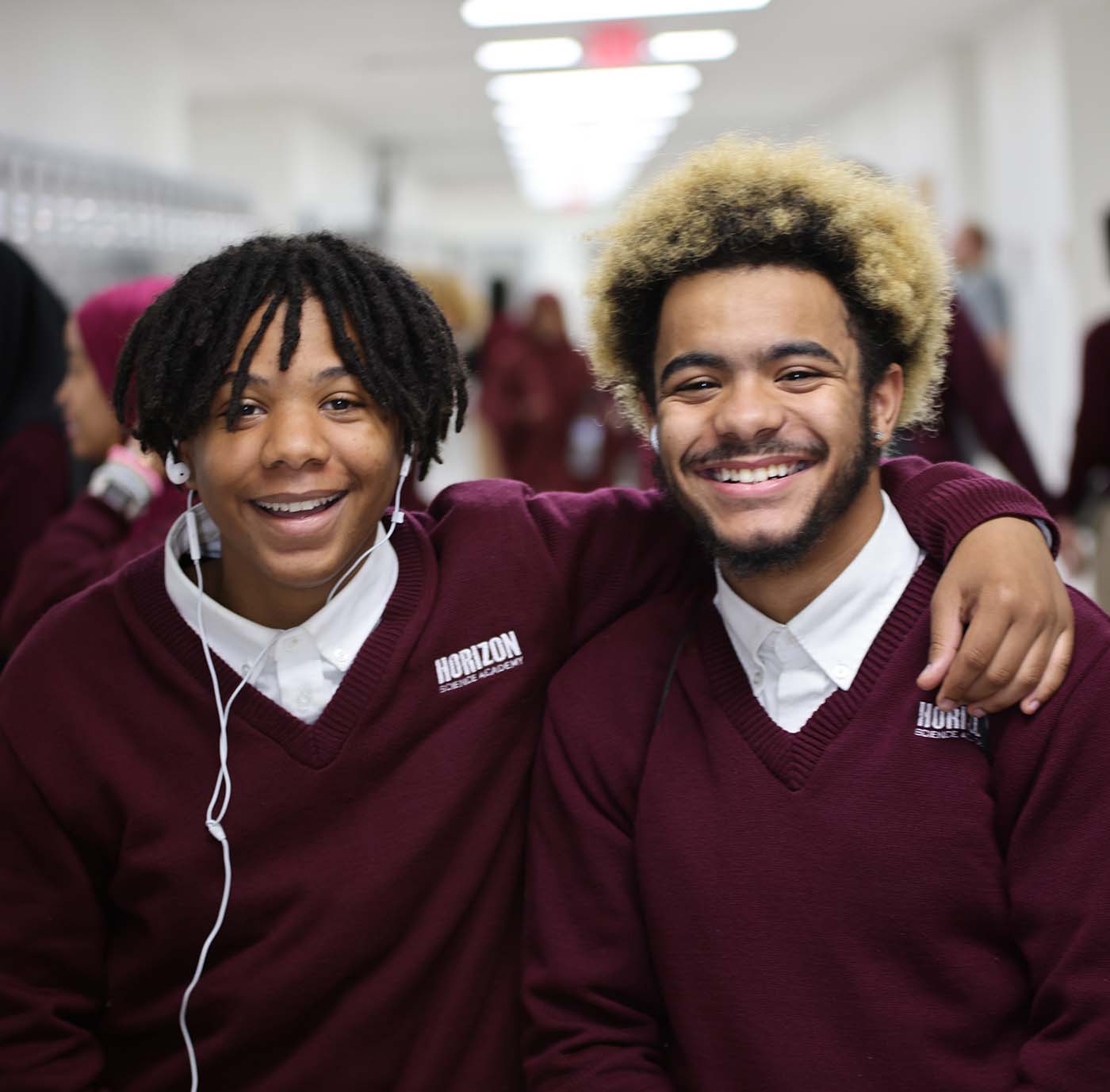Horizon Science Academy student drawing at a desk in a classroom setting